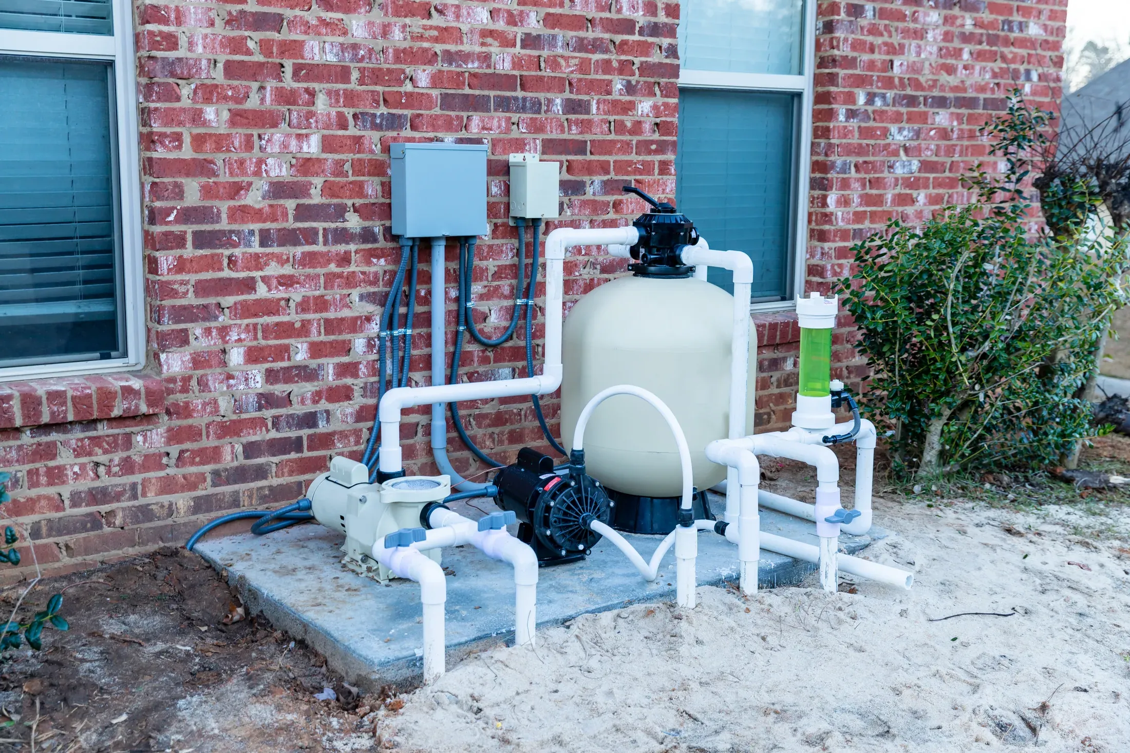 A residential pool pump and filter equipment pad, the kind of hardware behind most pool repair calls